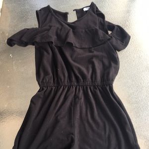 Black romper. Kids. Off the shoulders.